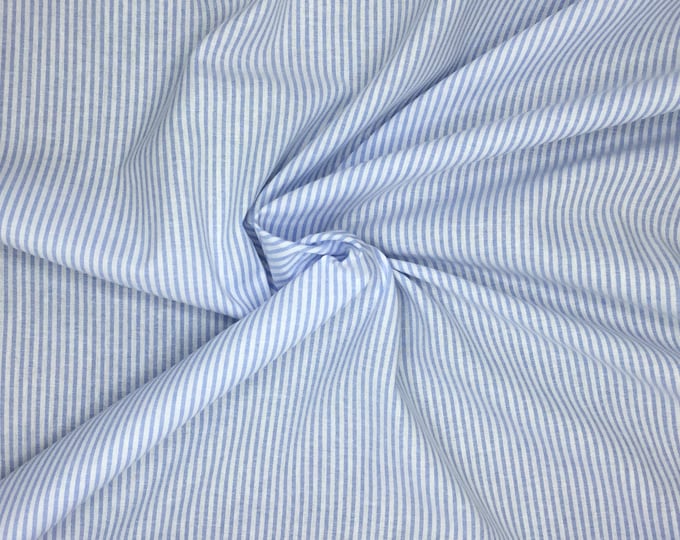 Striped, woven mixed cotton fabric. White and baby blue.