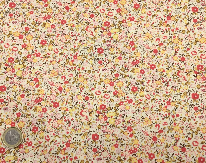 High quality cotton poplin with yellow floral on cream or ivory