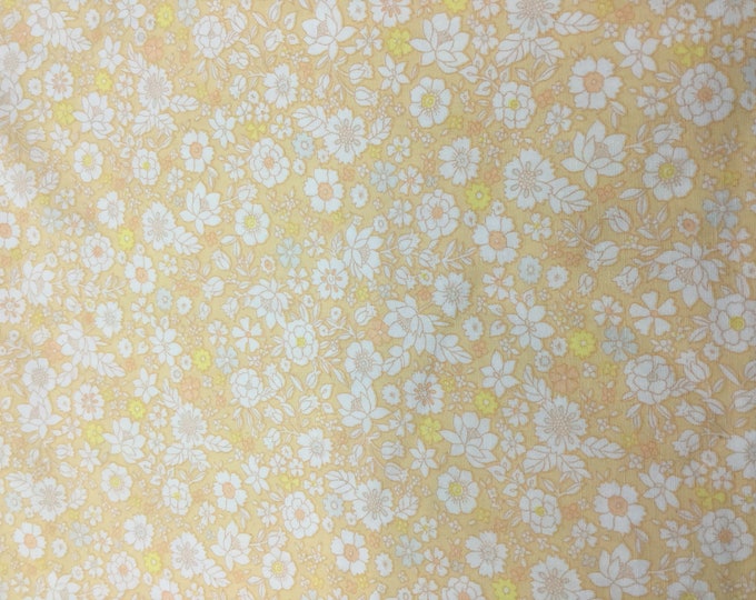 High quality cotton poplin, floral on cream, nearly orange