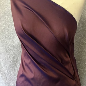 Two tone, iridescent faux dupioni taffetas silk fabric. Eggplant copper/royal blue nr53