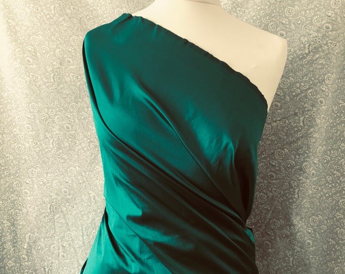 Two tone, iridescent faux dupioni taffetas silk fabric. Emerald green/black nr22