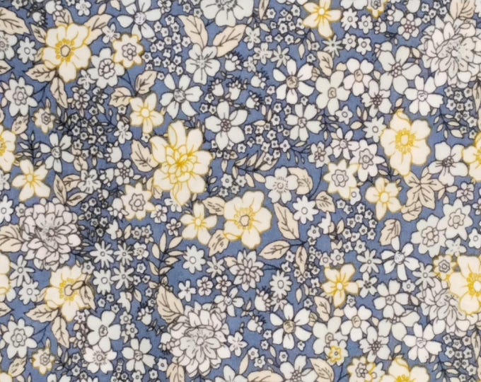 Cotton poplin with floral print, yellow flowers on storm blue