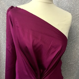 Two tone, iridescent faux dupioni taffetas silk fabric. Magenta/black nr36
