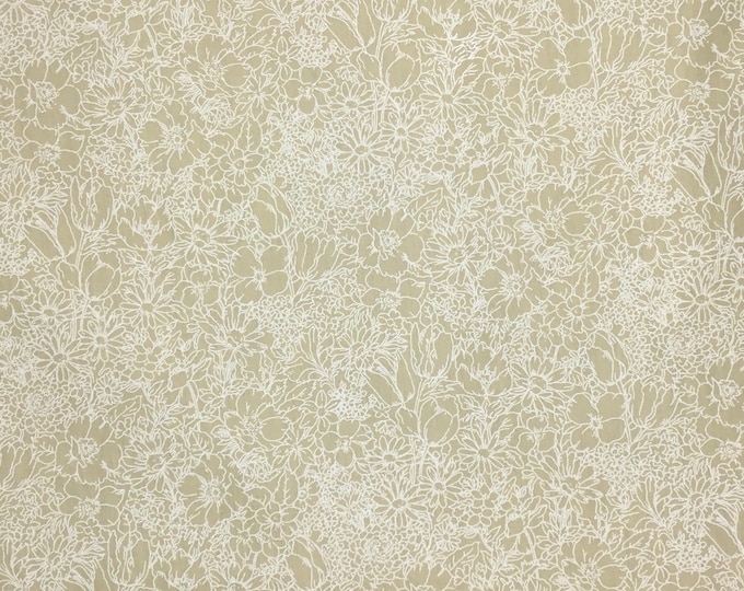 High quality oekotex cotton poplin dyed in Japan, white floral print on beige. A perfect fabric for all your projects.
