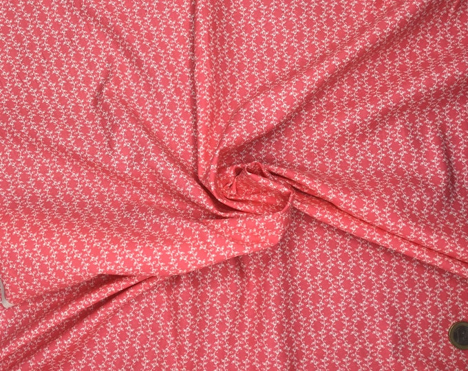 Cotton poplin with foliage on coral