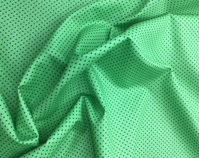 High quality cotton poplin. Dark grey polka dots on apple green nr32