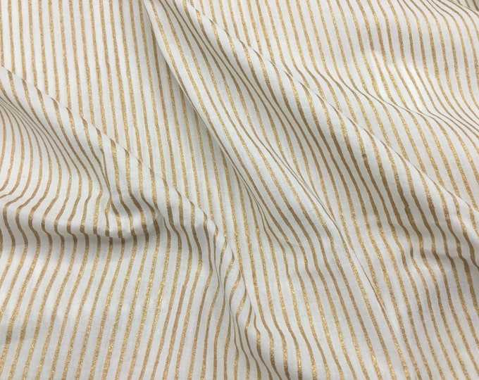 Indian block printed cotton muslin, hand made. Gold stripes on off white.