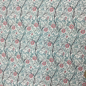 May include: A repeating floral pattern featuring red flowers, teal leaves, and black thorny stems on a white background. The design is reminiscent of a classic botanical print, suitable for fabric or wallpaper.