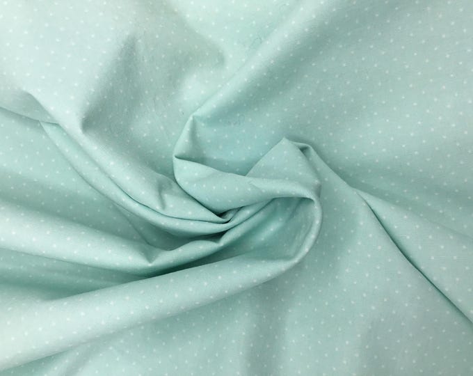 High quality cotton poplin, 1mm polka dots on pastel green
