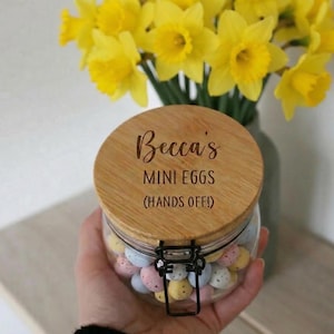 May include: A set of three ceramic mugs with a speckled, matte finish in cream, light grey, and dark grey. Each mug has a simple, minimalist design, suitable for coffee or tea.