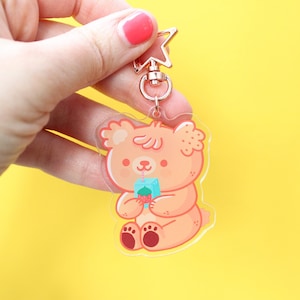 Paco The Bear drinking juice Acrylic Keychain, rose gold start shaped clip, bear character keychain 6 cm image 1