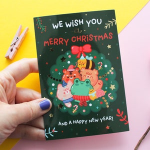 Christmas postcard "We wish you a Merry Christmas", printed on glossy paper with golden foil, 105x148mm