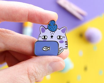 Nerd Cat Hard Enamel Pin with Silver Nickel Plating, 28mm wide.