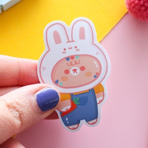 Mangue avec un chapeau de lapin, autocollant en vinyle mat découpé, autocollant imperméable.