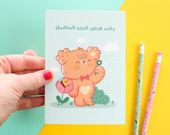 A6 Postcard - "Sending love your way" with Paco & Honey. Postcard printed on natural uncoated paper 324 gsm.