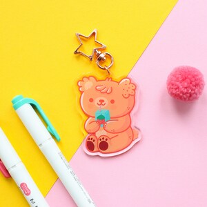 Paco The Bear drinking juice Acrylic Keychain, rose gold start shaped clip, bear character keychain 6 cm image 3