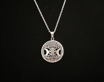 May include: Silver necklace with a circular pendant featuring a Celtic knot design with a triple moon and pentagram symbol.