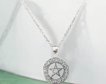 May include: A silver necklace with a circular pendant featuring a pentagram inside a Celtic knot design.