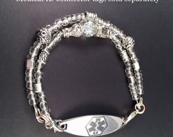 Interchangeable medical ID bracelet.                                        Clear with crackle and antique silver beads