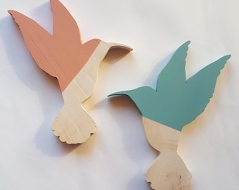 A handmade wooden hummingbird. A unique, colorful and poetic decoration.