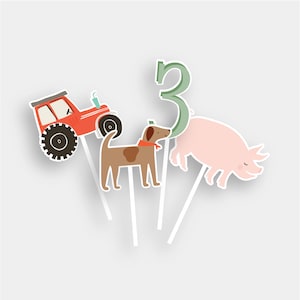 May include: A set of five farm-themed cake toppers. The toppers include a red tractor, a brown dog, a pink pig, and a green number three. The toppers are perfect for a farm-themed birthday party.