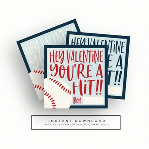 May include: Three printable Valentine's Day cards with a baseball theme. The cards are blue with white text and a red baseball. The text on the cards reads "Hey Valentine You're a Hit!" with a space for a name to be written in.