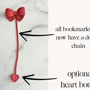 May include: A pink crocheted bookmark with a bow at the top and a heart at the bottom. The bookmark has a long chain that is double-stitched.  All bookmarks will now have a double chain. Optional: heart bottom.