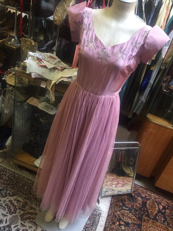 Lovely lavender formal dress of tge 1940s featurin