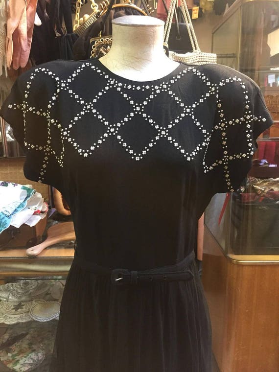 Wonderful black 1940s dress featuring white studs!