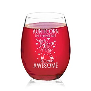 May include: A red wine glass with a white etched design of a unicorn doing the dab with the text "Aunticorn Like a normal aunt but more awesome".