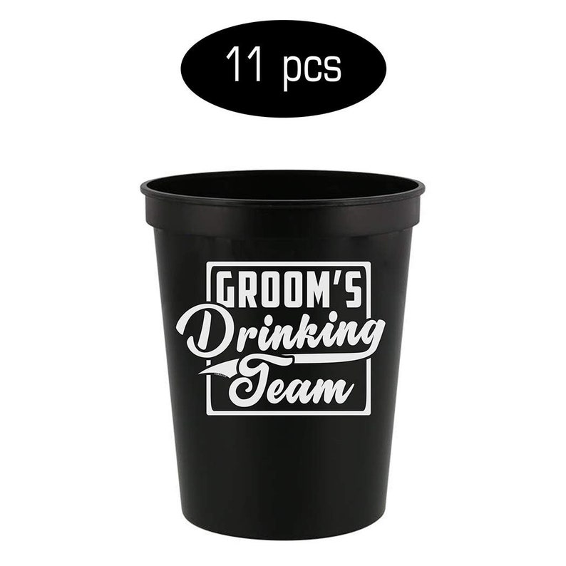 May include: A set of 11 black plastic cups with the text "Groom's Drinking Team" printed in white.
