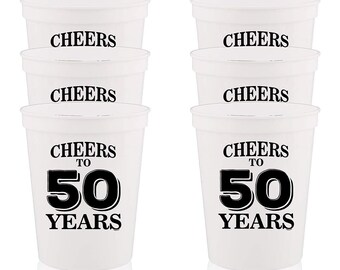 May include: Set of six white plastic cups with black text. The cups say "Cheers to 50 Years".
