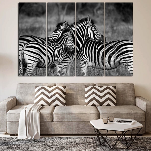 Black and white image of zebras printed on canvas for wall decoration. Minimalist picture for office decor. Modish artwork. Wild life poster