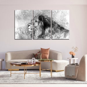 May include: A black and white canvas print of a lion's head with a textured background. The print is divided into three panels.