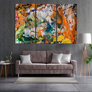 May include: Abstract art print with a colorful, textured design in shades of yellow, orange, green, blue, and white. The print is divided into three panels.
