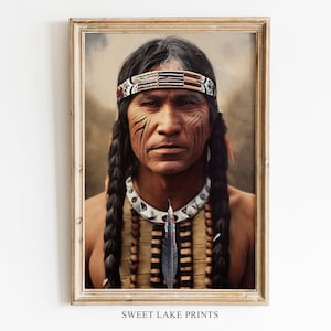 May include: A framed portrait of a Native American man. He has long, dark braids, a beaded headband, and facial markings. He wears a beaded necklace with a feather pendant. The artwork is set against a neutral background.