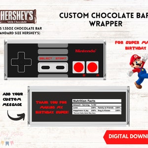 May include: Printable digital download for a custom chocolate bar wrapper featuring a Nintendo Super Mario theme. The wrapper has a black and gray Nintendo controller design with red buttons and the text "Nintendo". The wrapper also features a red and blue Super Mario character and the text "For Super Mario Birthday".