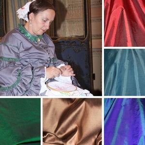 May include: A collage of fabric swatches in various colors, including red, teal, green, brown, and purple. The fabric has a silky sheen and a smooth texture.