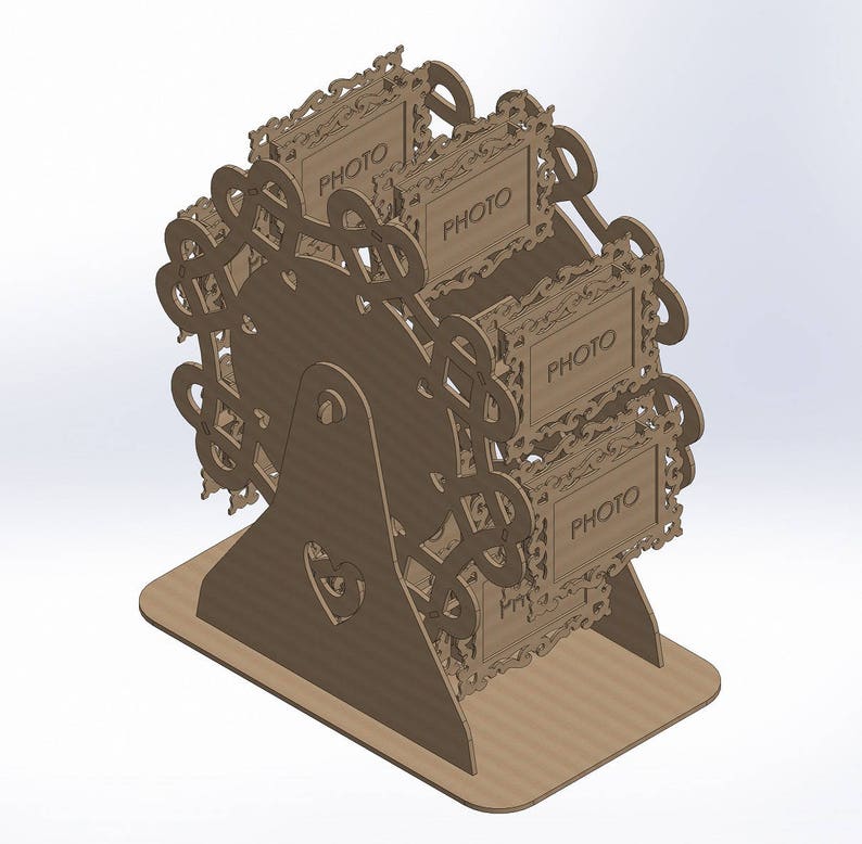 May include: A brown, laser-cut Ferris wheel photo display. The display has four photo frames with the word "PHOTO" on each. The design includes decorative swirls and a heart-shaped cutout on the base. The display is made of cardboard.