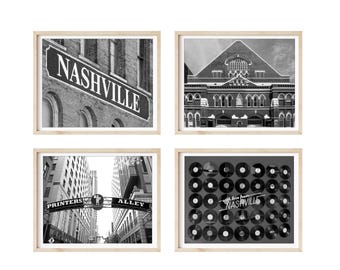 May include: A set of four black and white photographs of Nashville, Tennessee. The first photo shows a sign that reads "Nashville". The second photo shows the Ryman Auditorium. The third photo shows a street sign that reads "Printers Alley". The fourth photo shows a wall covered in vinyl records with the text "With love from Nashville".