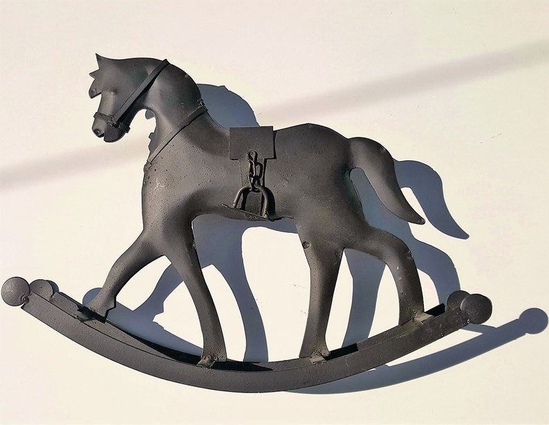 old metal rocking horse