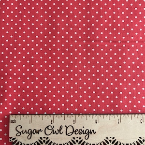 May include: Red fabric with a white polka dot pattern. The fabric is measured with a ruler that says "Sugar Owl Design".