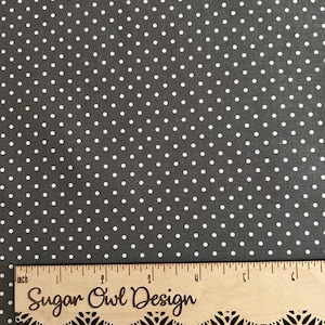 May include: Gray fabric with a white polka dot pattern. The fabric is measured with a ruler that says "Sugar Owl Design".