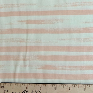 May include: White fabric with horizontal pink stripes. The stripes have a brushed or textured look. A wooden ruler with the words "Sugar Owl Design" is at the bottom of the image.