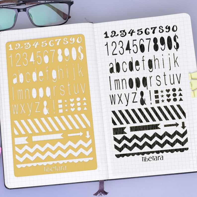 May include: A yellow stencil with white numbers, letters, symbols, and patterns. The stencil is on a white page with a black grid pattern. The text "Tibetara" is printed on the stencil.
