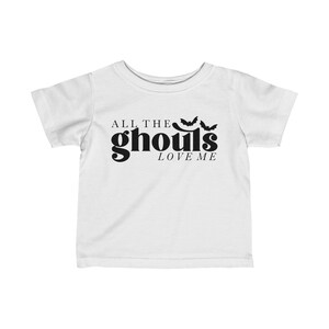 May include: White toddler t-shirt with black text that reads "All the ghouls love me" and three black bat silhouettes.