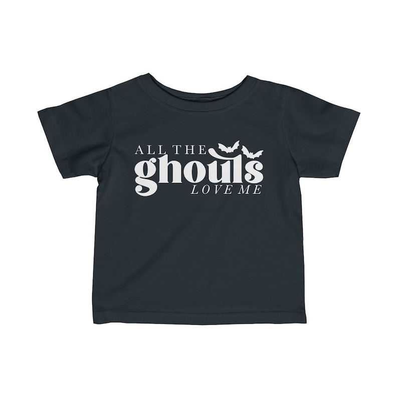 May include: A dark blue toddler t-shirt with white text that reads "All the ghouls love me" and three white bat silhouettes.