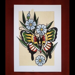 May include: A watercolor painting of a butterfly with yellow, red, and black wings. The butterfly is surrounded by blue and white flowers with green leaves.
