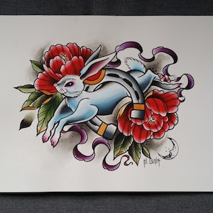 May include: A watercolor painting of a white rabbit jumping over a horseshoe with red flowers and purple ribbons. The artist's signature "pl. Lupit" is in the bottom right corner.