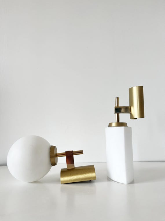 Pair of gilded metal wall lights and opaline globe, 1960